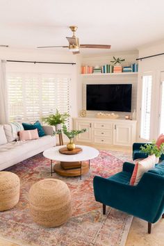 a living room filled with furniture and a flat screen tv