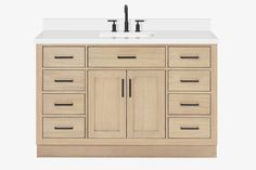 a white sink sitting under a wooden cabinet