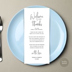 a blue plate with a menu on it next to a fork and knife, along with a place card