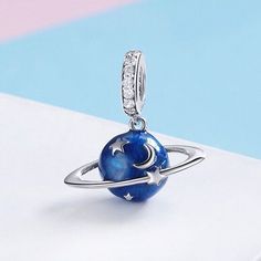 This is charm only, bracelet is sold separately. Add a touch of elegance to your jewelry collection with this stunning 925 sterling silver charm from The Silver Luna. The blue planet enamel pendant is designed to complement any bracelet or necklace, and the sparkling cubic zirconia stone adds a touch of sophistication. Crafted from high-quality silver, this charm is perfect for any occasion and makes a wonderful gift for a loved one. Get ready to turn heads with this eye-catching piece. This charm is categorized under Bracelets & Charms, Fine Jewelry, Jewelry & Watches, and it's a great addition to your jewelry collection. With its unique design and flawless craftsmanship, you can wear it on any occasion. So, why wait? Order now and add a touch of elegance to your jewelry collection. Dimen Moon Star Pendant, Silver Jewelry Accessories, Beads Charm, Fitness Bracelet, Original Jewelry, Moon Star, Handmade Charms