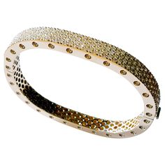 This stunning two section 18 karat Yellow gold bangle style bracelet is accented with 171 carefully matched white round brilliant diamonds weighing approximately 4.16 carat total. Inspired by art and fashion, Novel Collection is presenting its creativity and superlative craftsmanship. Absolutely unique pattern is reproduced in a retro design; easy to wear and highly versatile, this elegant concept will touch your essence. This piece was Hand made at the Novel Collection Jewelry Atelier, speciali Modern Yellow Gold Bangle With Brilliant Cut, Jewelry Atelier, Elegant Concept, Novel Collection, Pave Bangle, Retro Bracelet, Yellow Gold Bangle, Diamond Supply, Bangles Style