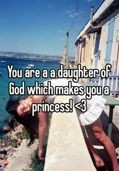 a woman leaning against a wall with the words you are a daughter of god which makes you