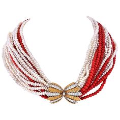 Fabulous elegant necklace created by Mario Buccellati in Italy in the 1950's. Features ten strands of white freshwater pearls and six strands of Mediterranean coral connected with a diamond and yellow & white gold clasp. The necklace has a lot of volume and can be worn with the clasp either on the back (more casual look) or on front/side (dressier look). The clasp is made of 18k yellow gold and white gold and set with twenty six round cut diamonds. Black Beaded Jewelry, Clasp Necklace, Elegant Necklace, White Freshwater Pearl, Pearl Diamond, Elegant Necklaces, Multi Strand Necklace, Look Plus, Multi Strand