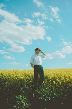 a man standing in the middle of a field