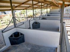 the inside of a building with several bins in it