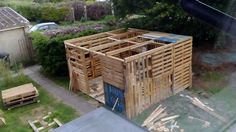 a wooden structure sitting in the middle of a yard