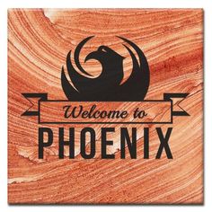 a wooden sign that says welcome to phoenix