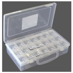 an open plastic storage box filled with lots of small pieces of white stuff in it