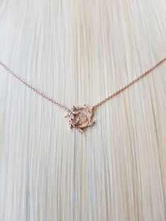 "Simple Dainty Leaf Wealth Wrap Necklace Chain Length: 15\" Chain Extension: Yes Chain Extension Length: 2\" Clasp: Yes Type of Clasp: Lobster Claw Pendant Length: 1/2\" Pendant Width: 1/2\" Chain Width: 1 mm Weight: 2g Metal: Rhodium or gold plated chains, Rhodium plated pendant, Tarnish resistant Material: Crystal" Rose Gold Clavicle Chain Necklace With Flower Pendant, Rose Gold Flower Pendant Clavicle Necklace, Rose Gold Adjustable Chain Pendant Necklace, Rose Gold Adjustable Pendant Chain Necklace, Rose Gold Pendant Chain Necklace With Adjustable Chain, Rose Gold Delicate Chain Crystal Necklace, Rose Gold Crystal Necklace With Delicate Chain, Dainty Rose Gold Necklaces With Chain, Dainty Rose Gold Chain Necklace