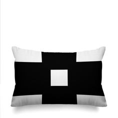 a black and white pillow with a square in the middle