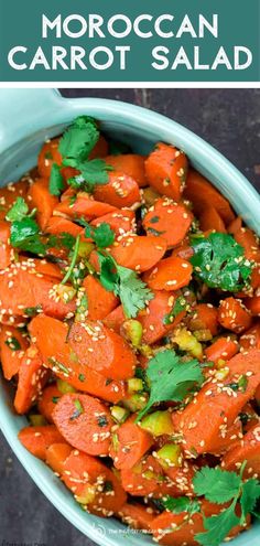 carrot salad with sesame seeds and cilantro in a blue bowl