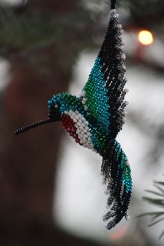 a hummingbird is flying through the air