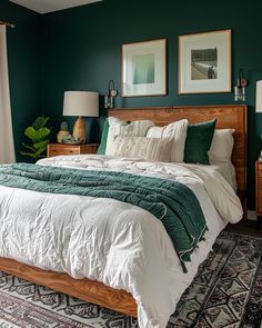 a bedroom with green walls and white bedding