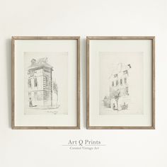 two framed drawings are hanging on the wall