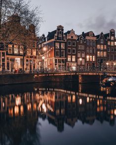 a canal with many buildings along it at night