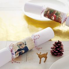 a roll of toilet paper sitting on top of a table next to a christmas decoration