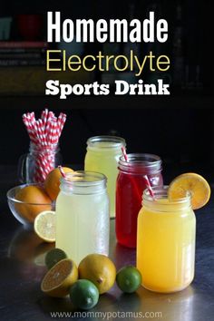 three jars filled with different types of drinks and lemons next to each other on a table