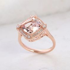 This Luxoro 10K rose gold ring for women features a AAA Marropino morganite gemstone in a halo design, symbolizing eternal love and commitment. The cushion-shaped morganite centerpiece, encircled by round diamonds, is finely and skillfully cut for captivating sparkle and durability. Gold Ring For Women, Morganite Gemstone, Halo Design, Morganite Ring, Treasure Chest, Size 10 Rings, Eternal Love, Ring For Women, Morganite