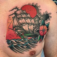 a man's chest with a ship on it