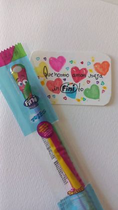 a toothbrush with a cartoon character on it next to a sticker that says i love you