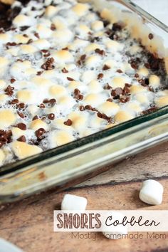 a casserole dish with marshmallows and chocolate