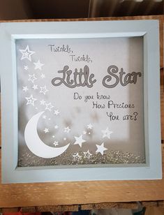 a little star framed in a wooden frame