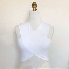 This Very Sexy Criss Cross Crop Top Is A Crisp White & Soo Flattering. Can Be Dressed Up For Date Night , Cocktails, Festival Season, Coachella Or Casual With Jean Shorts For A Summer Day. I Would Actually Consider This A Year Round Piece. So Comfortable And A Very Unique Cut. Condition - Nwot Only Worn To Try On Criss Cross Top Dress, White Summer Top With Crisscross Straps, White Criss Cross Top, Cross Top Dress, Fitted White Crop Top With Crisscross Straps, Fitted Crisscross Crop Top With Built-in Bra, Stretch Cross-tied Sleeveless Crop Top, Bandage Crop Top, Criss Cross Top