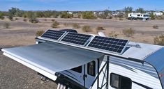 an rv with solar panels on the roof