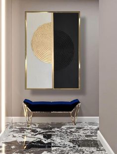 a black and white marble floor with a blue velvet bench in front of a gold framed art piece