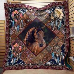 a horse is shown on a blanket in front of a wall with flowers and feathers