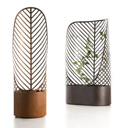 two vases with plants in them sitting next to each other