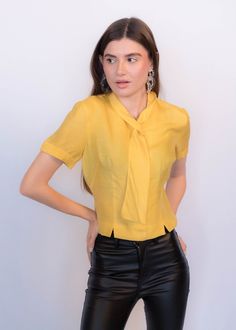 Luxury Semi-stitched Yellow Blouse, Chic Fitted Tie Neck Top, Chic Fitted Top With Tie Neck, Vintage Silk Short Sleeve Blouse, Vintage Silk Blouse With Short Sleeves, Semi-formal Tie Neck Fitted Blouse, Semi-formal Fitted Tie Neck Blouse, Formal Fitted Tie Neck Blouse, Yellow Fitted Top For Office