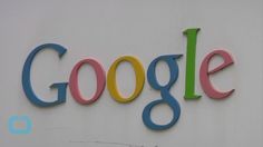 the google logo is displayed on a wall