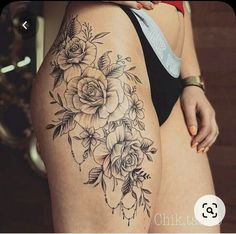 a woman's thigh with flowers on it