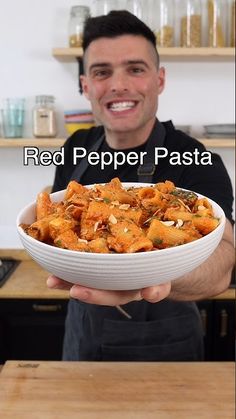 a man holding a white bowl filled with food