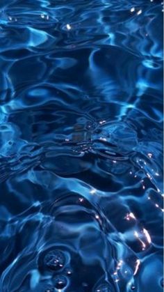 blue water with ripples and reflections on it