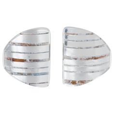 pair of silver and white striped cufflinks with metal strips on each side, set against a white background