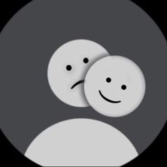 two white smiley faces in a black circle