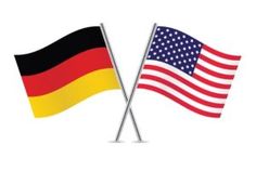 two american and german flags crossed over each other