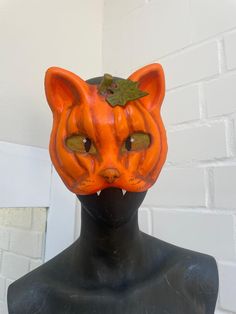 Therian mask pumpkin cat 🎃 * Mask out of hard paper mache * painted eyes still with good sight * 3D pumpkin optic * hand-painted * lined on the inside * clay nose with realistic texture and little shine * pumpkin leaf * comfortable to wear * not waterproof! * comes with a very little surprise <3 It is a hand made product so please be careful handling it. Do not pull on the fur, try to scrape off paint or anything else. You cannot send it back to me or get your money back if you do not like it. Halloween Cat Design Masks And Prosthetics For Costume Party, Halloween Cat Design Mask For Costume Party, Halloween Masquerade Mask With Cat Design, Halloween Cat Design Masks And Prosthetics With Cat Ears, Halloween Cat Ears Mask With Whiskers, Halloween Masquerade Masks With Whiskers, Clay Nose, Therian Masks, Pumpkin Leaf