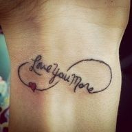 a woman's wrist tattoo with the words i love you more