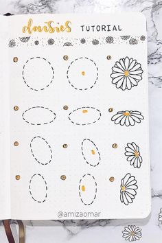 an open planner with flowers on it