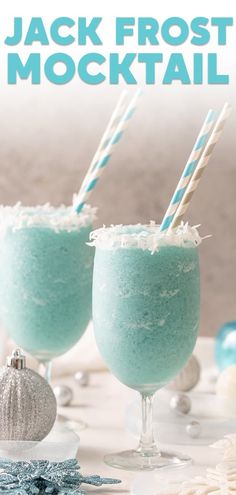 two glasses filled with blue liquid and topped with marshmallows