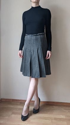 Elegant wool pleated skirt. Satin waist detail. A timless design. Condition: Great vintage condition Label size: US 6 EU 38 Model is 169 cm/5.6" tall and wears S,M Materials: 60% wool 25% polyester 10% polyamide 5% viscose Flat measurements: - waist  36 cm / 14.1" - hips 50 cm / 19.6" - length 58 cm / 22.8" Side zipper closure Our second hand garments are carefully picked from various locations. Each piece can make a unique and sustainable addition to your wardrobe. Some of the items might have Wool Pleated Skirt, Skirt Satin, Pleated Midi Skirt, Label Sizes, Pleated Skirt, Bulgaria, Side Zipper, Midi Skirt, Second Hand