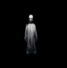 a ghostly figure standing in the dark