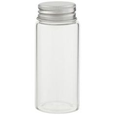 an empty glass jar with a silver lid on a white background, for food storage