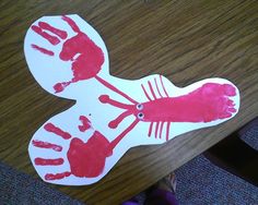 a child's hand and foot print on a table