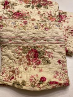 two bedspreads with floral designs on them