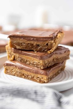 three chocolate peanut butter bars stacked on top of each other with text overlay that reads, lunch lady peanut butter bars