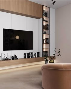 a living room filled with furniture and a large flat screen tv mounted on the wall